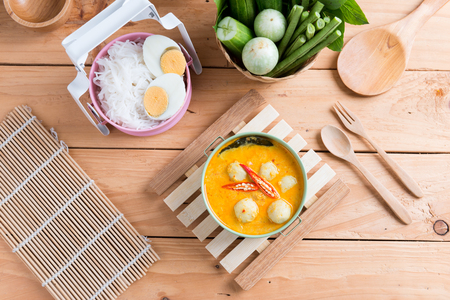 Coconut milk Curry fish and fish ball eat with thai rice noodle ( Kanom jeen nam ya ) , boiled egg and vegetableの写真素材