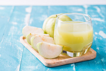 Guava juice and fresh Guava on wooden backgroundの写真素材