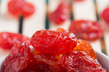 Dried Cherries Tomatoes Candied fruit on rustic green wooden backgroundの写真素材