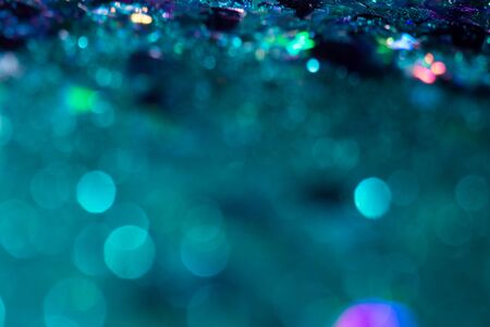 Colorful glitter abstract background with bokeh defocused lights christmasの写真素材