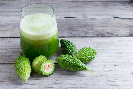 Herbal juice of green momodica , Balsam apple, Balsam pear, Bitter cucumber , Bitter gourd , Stuffed bitter gourd, karela in a glassの写真素材