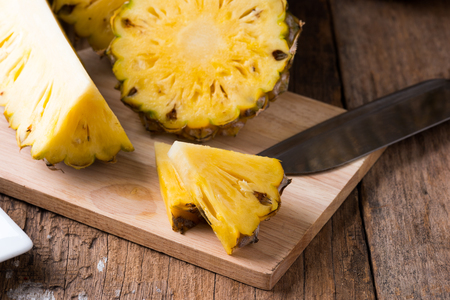 pineapple on the wooden texture backgroundの写真素材