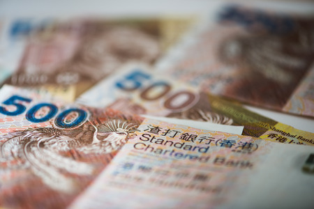 Pile of many Hong Kong Dollar banknotes as money background.の写真素材