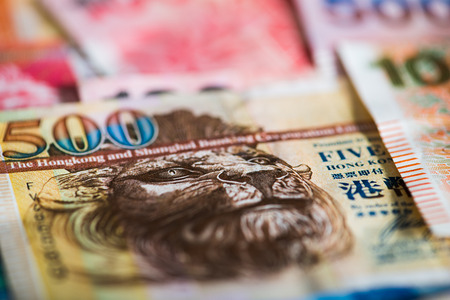 Pile of many Hong Kong Dollar banknotes as money background.