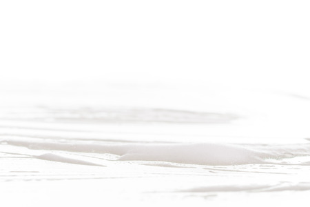 White foam bubbles texture isolated on white backgroundの写真素材