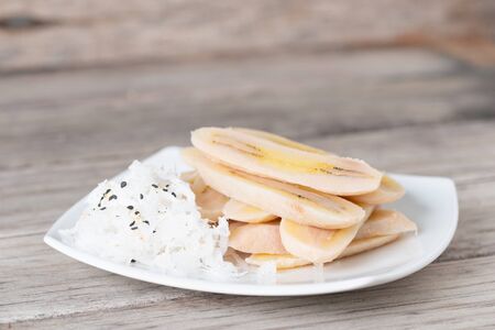Boiled slice banana eat with coconut food for dietの写真素材