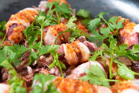Steam Squid with Spicy Chili and Lemon Sauce.  Pla Muk Nung Manow.