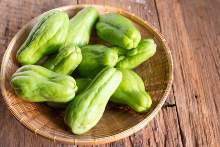 Fresh chayote fruits (Sechium edulis) on wooden backgroundの写真素材