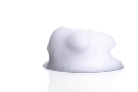 White foam bubbles texture isolated on white backgroundの写真素材