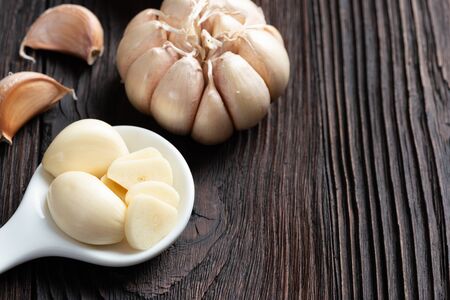 Garlic on wooden tableの写真素材