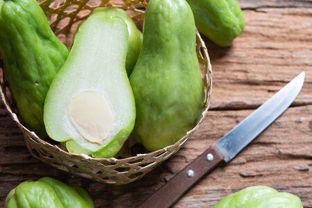 Fresh chayote fruits (Sechium edulis) on wooden backgroundの写真素材