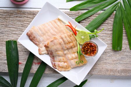 Grilled slices of pork belly with spicy sauce , asian foodの写真素材