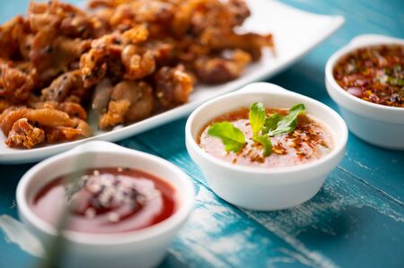 Crispy fried sliced belly pork with spicy sauce , asian foodの写真素材