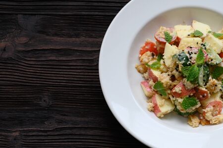 Dietary food apple qunoa salad with cucumber and almondの写真素材