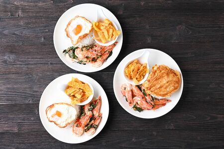 Stir fried Spicy Prawn , Thai Holy Basil With  Steamed Rice And Fried egg , Asian Foodの写真素材