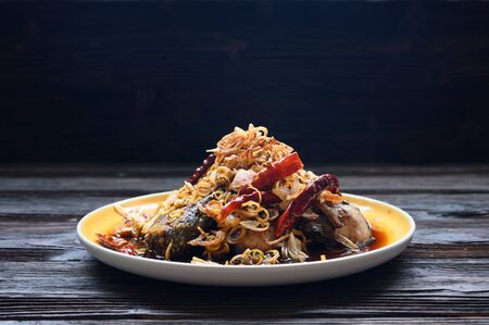 Fried fish with lemon grass, sweet sauce and trimmingsの写真素材