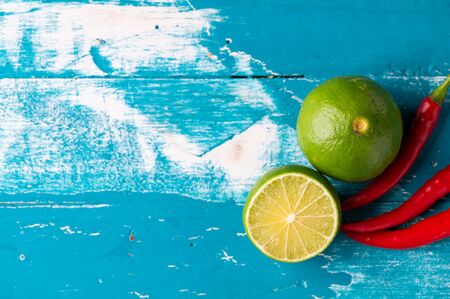 Fresh lime, half on wood background. Green citrus fruit. Food Photography.の写真素材