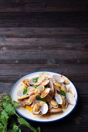 Stir fried Spicy Clam (Surf clam, Short necked clam, Carpet clam, Venus shell, Baby clam) with Thai Holy Basil , Asian Foodの写真素材