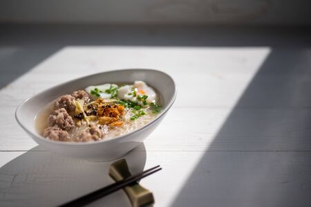 Thai style clear soup rice noodle in traditional bowl. Selective focus , Asian Food