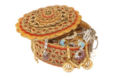 Gold jewelry in a wooden beauty box isolated on white