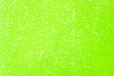 Green bath soap with bubblesの写真素材