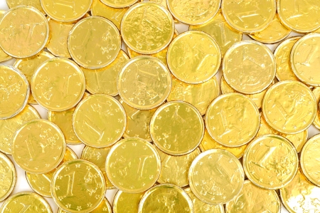 Gold coins of one euro background, isolated on white