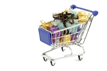 Shopping card with  gift boxes  on a white backgraundの写真素材