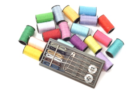 Cotton thread bobbins, on a white background