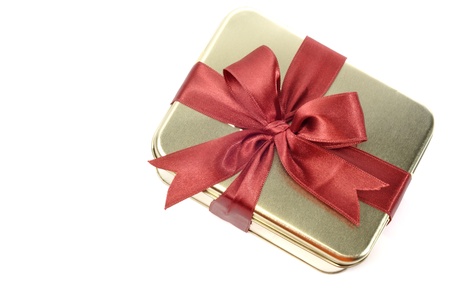 Steel metal gift box with red ribbon, on a white backgroundの写真素材
