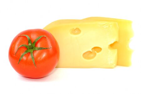 Fresh yellow cheese and tomato ,  on a white backgroundの写真素材