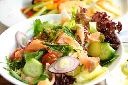 Fresh vegetable salad with smok salmon fishの写真素材