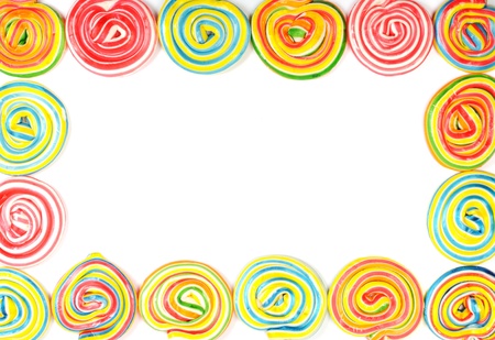 A lot of colorful lollipops , frame with white background