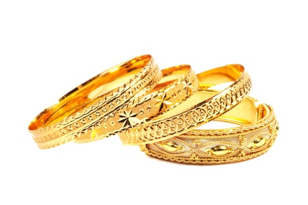 Golden bracelets , isolated on white background