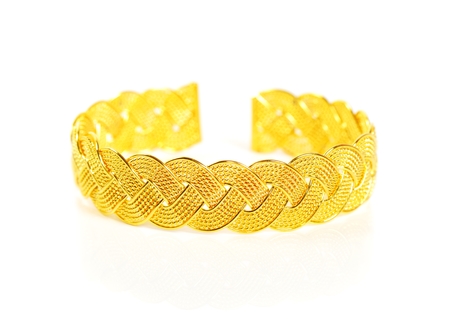 Gold bracelet on white