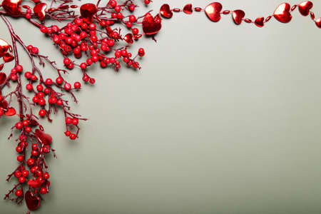 Christmas concept card with red decor on olive background.の写真素材