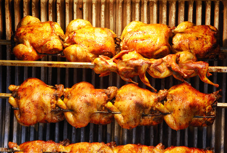 Delicious grilled and crispy chickens on a skewer friedの写真素材