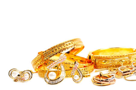 Golden precious jewelry , isolated on white backgroundの写真素材