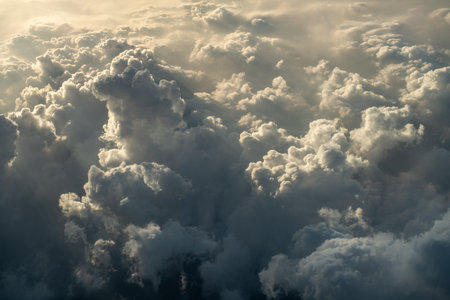 Cloudscape, view from the window of an airplane flying above the clouds.
Clouds background during...