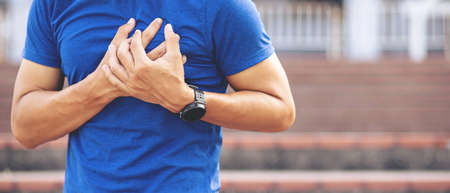 Close up picture.A sportsMan have Severe heartache, Having heart attack.healthcare and health problem concept.の写真素材