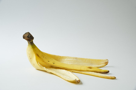 Peel banana on the white backgroundの写真素材