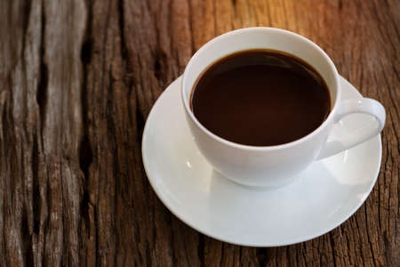 A black coffee in white cup on the tableの写真素材