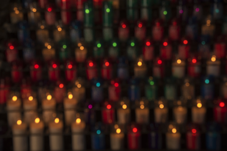 Blurred background of multi-colored candle lightsの写真素材