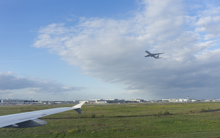 Frankfurt airport, Germany-September 7, 2017: An airplane taking off the runway, view from window of the other airplaneのeditorial素材