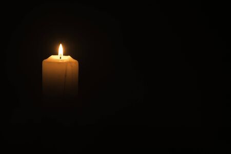 A candlelight on the black backgroundの写真素材