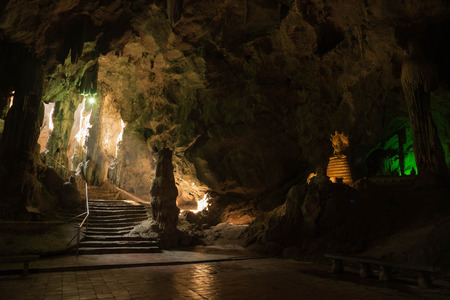 Beautiful sunray in cave and Buddha at Khao Luang, Pethchaburi, Thailandの写真素材