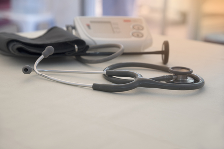 Stethoscope, sphygmomanometer and hammer on the table in doctor officeの写真素材