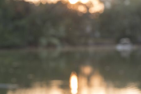 Blurred background of sunset in the parkの写真素材