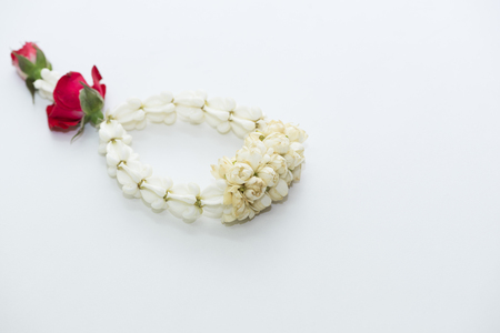 A beautiful white jasmine garland on white backgroundの写真素材