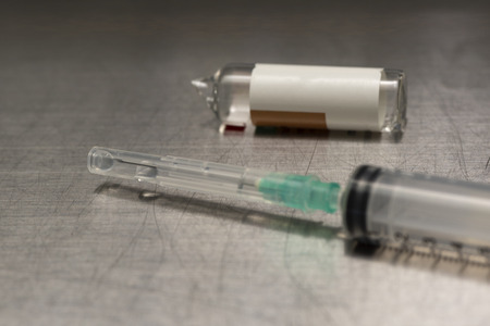 Medication for injection in a syringe and needle preparing from vial of drug for anesthesiaの写真素材