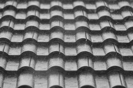 Raindrop on the roof of a house in black and whiteの写真素材